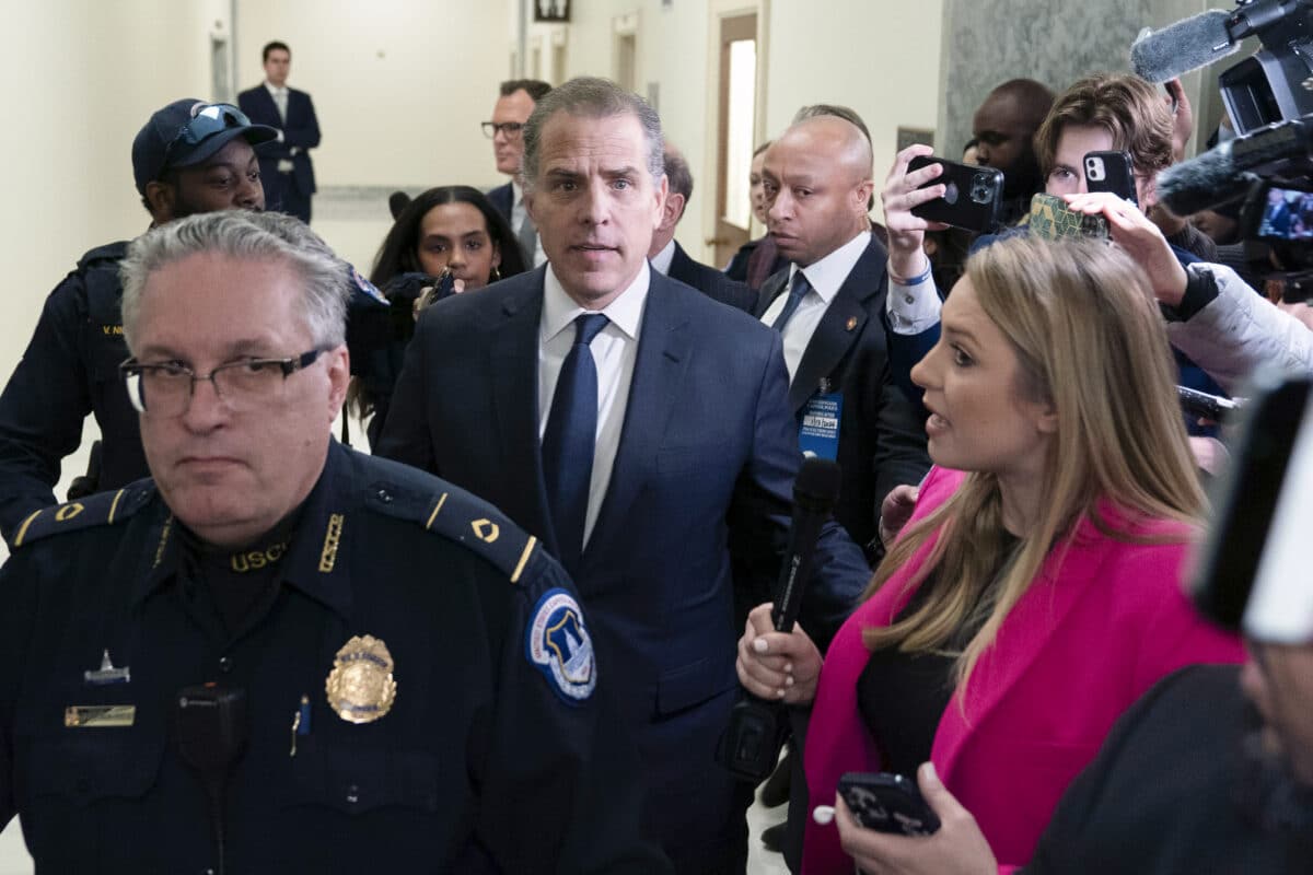 Hunter Biden, President Joe Biden's son, center, leaves a House Oversight Committee hearing as Republicans are taking the first step toward holding him in contempt of Congress, Wednesday, Jan. 10, 2024, on Capitol Hill in Washington.
