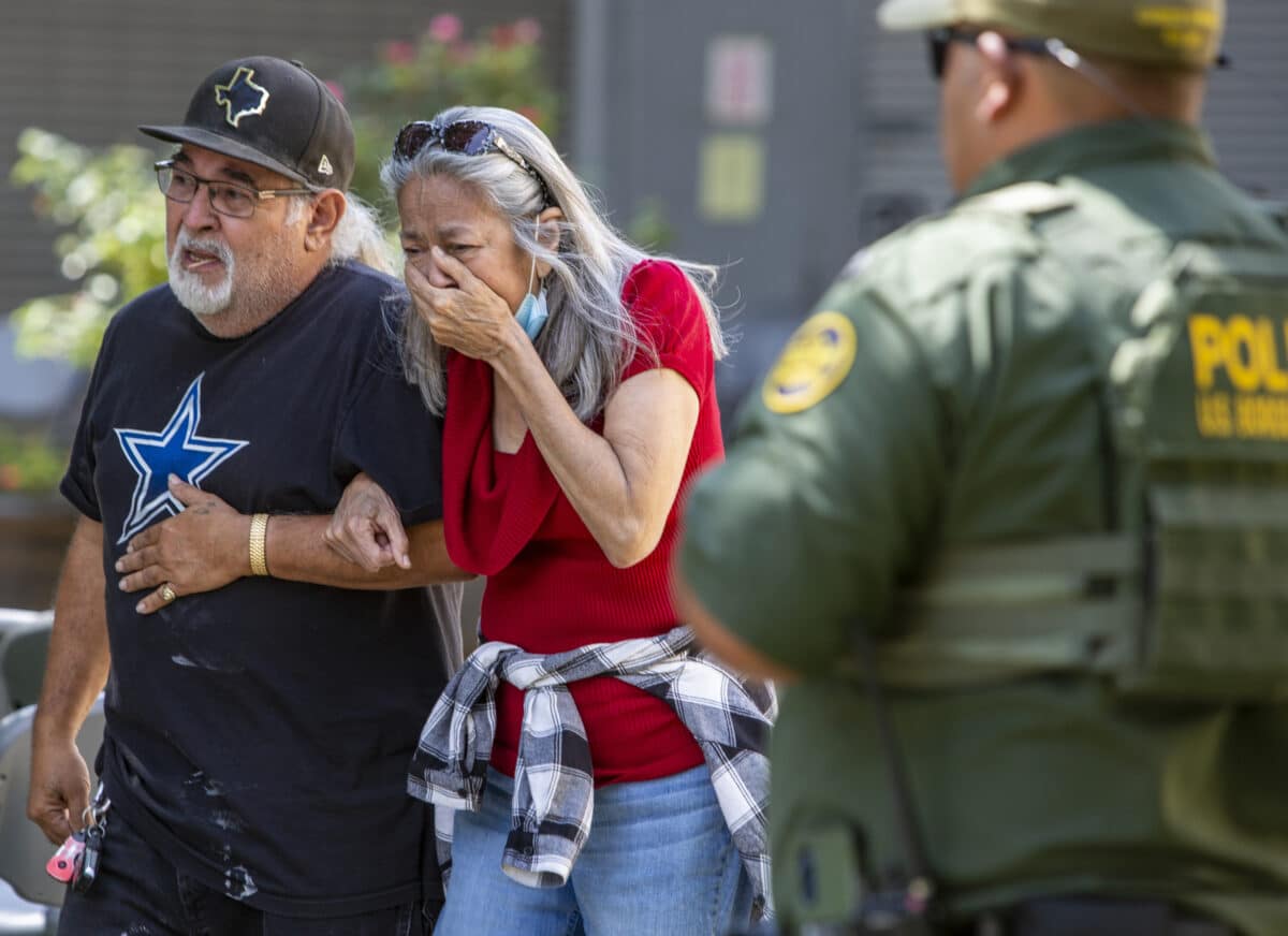 A woman cries as she leaves the Uvalde Civic Center, Tuesday May 24, 2022, in Uvalde, Texas, after a mass shooting.
