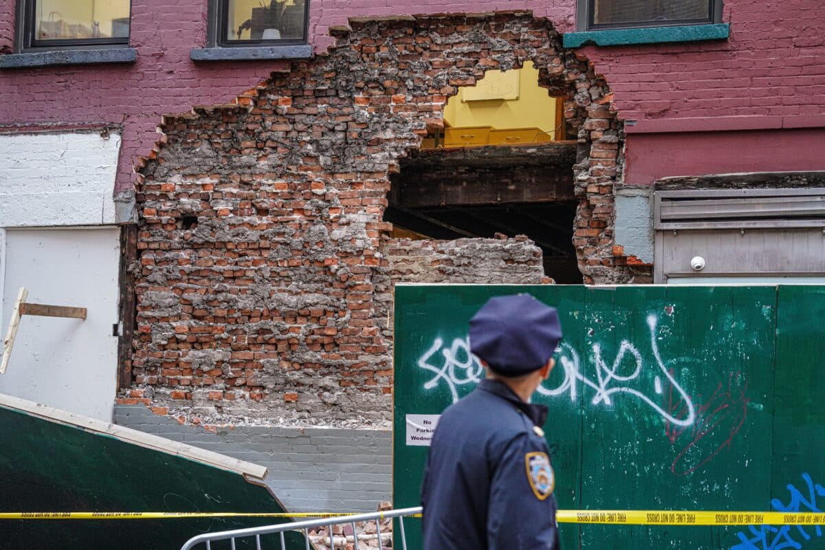 The brick façade of a Little Italy building fell on Wednesday afternoon.