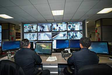NYPD officers watch subway cameras at Brooklyn hub