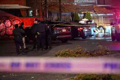 Police investigate the scene of the shooting in Flatlands, Brooklyn.