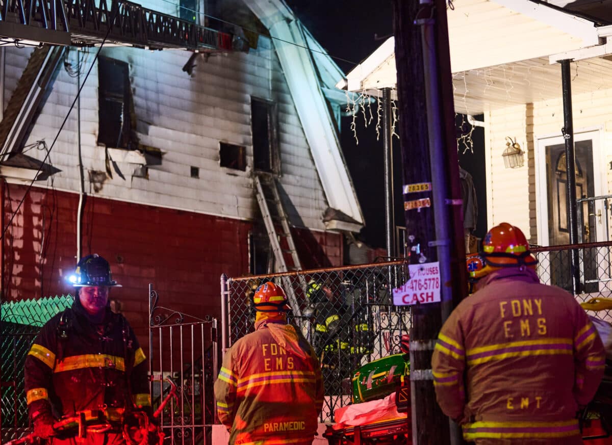 Firefighters work to put out the fatal fire in Queens on Monday night.