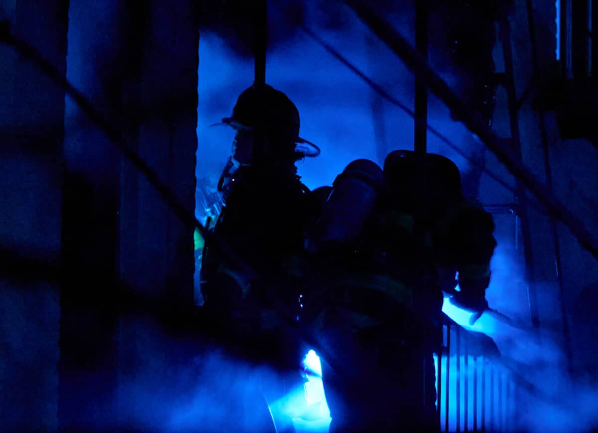 Firefighters operate in a heavy smoke condition while battling an all hands fire at 1514 West 4 Street.