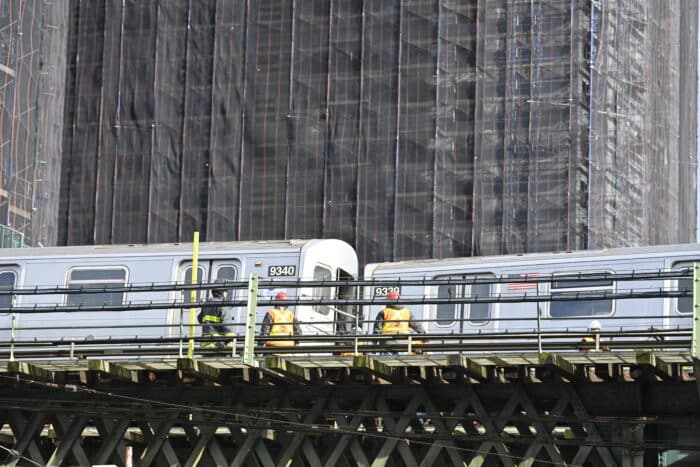 Crews work on F train after it derailed in Brooklyn