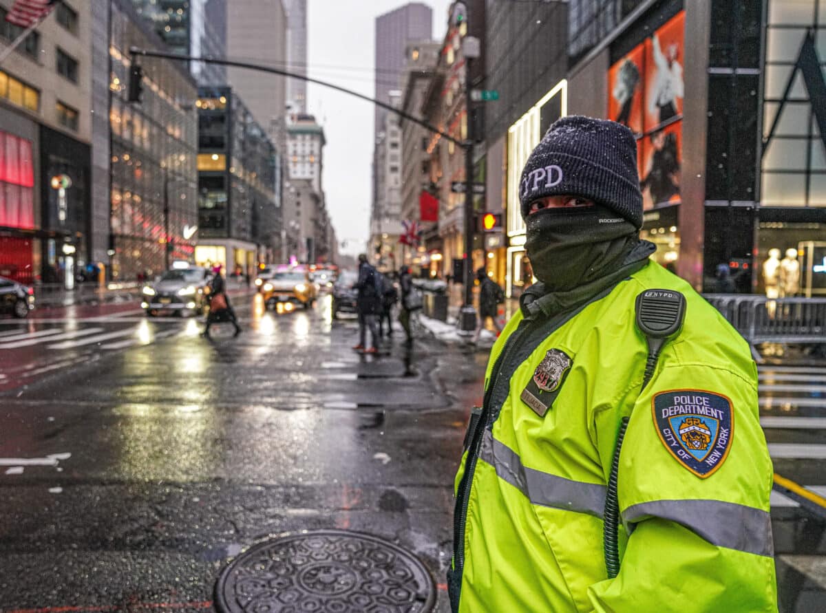 NYC traffic agent on snow-slick street
