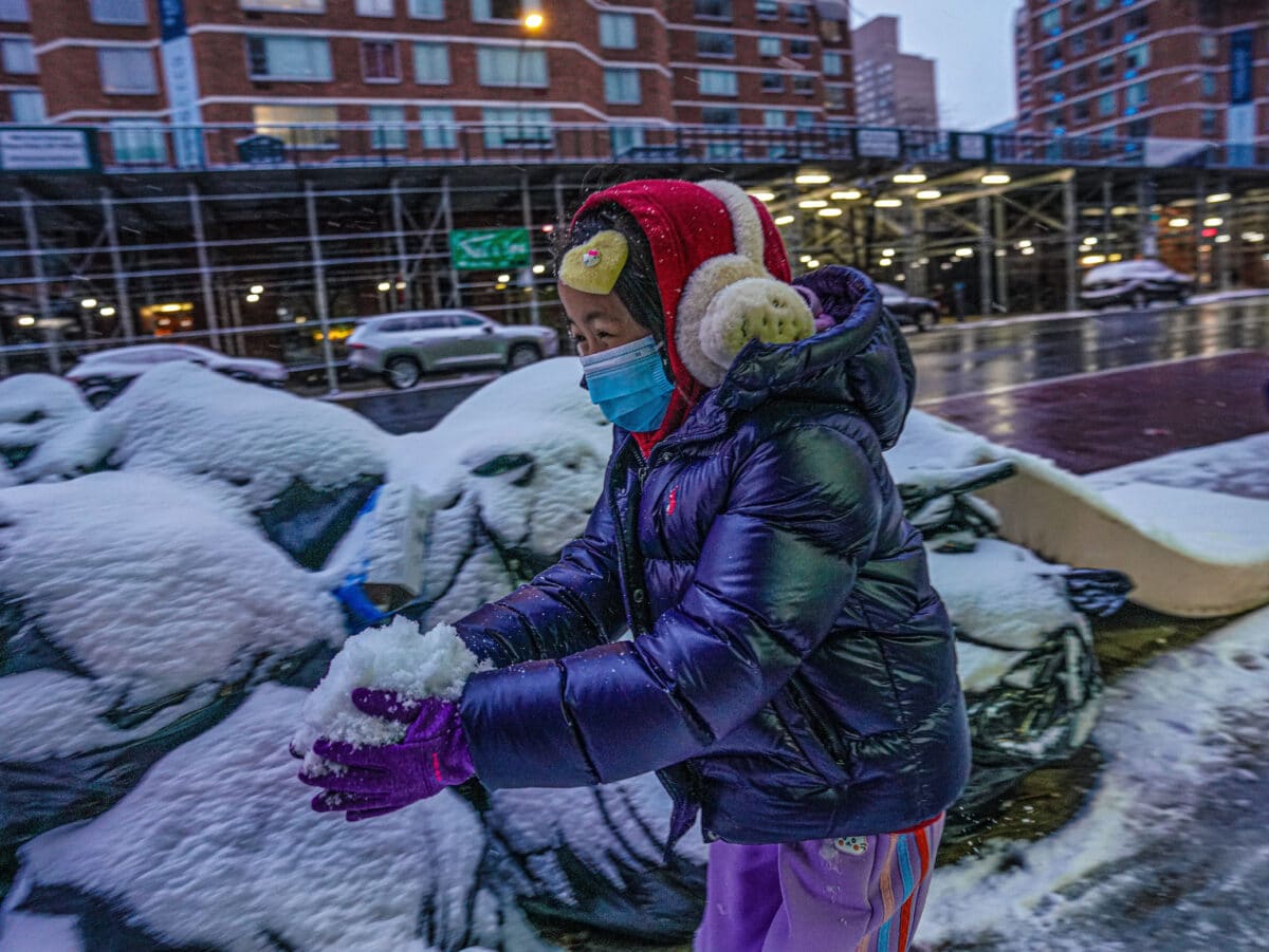 New York City child creates snowball