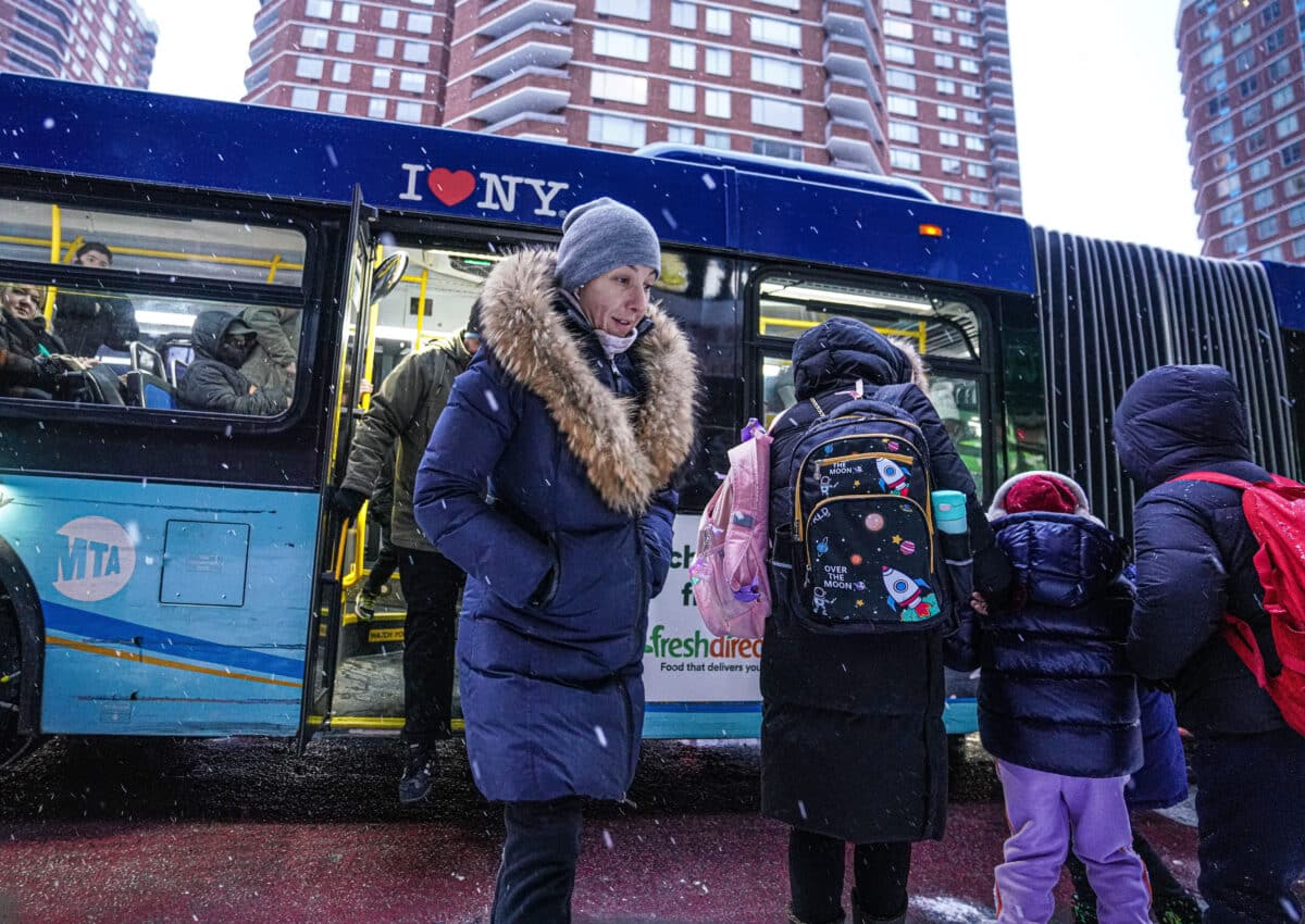 People file on bus as snowless streak ends