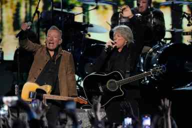 Bruce Springsteen and Jon Bon Jovi on stage singing