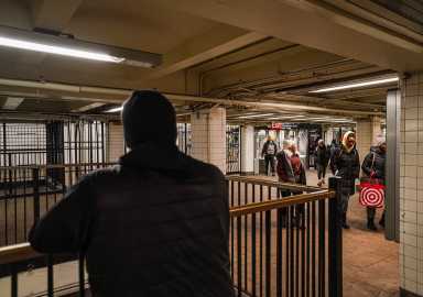 NYPD transit officer patrols subway station