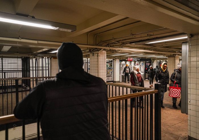 NYPD transit officer patrols subway station