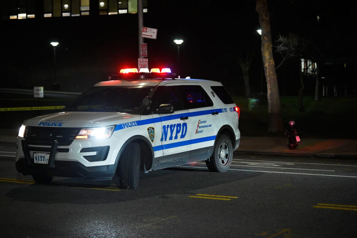 An NYPD vehicle at the scene of a crime.