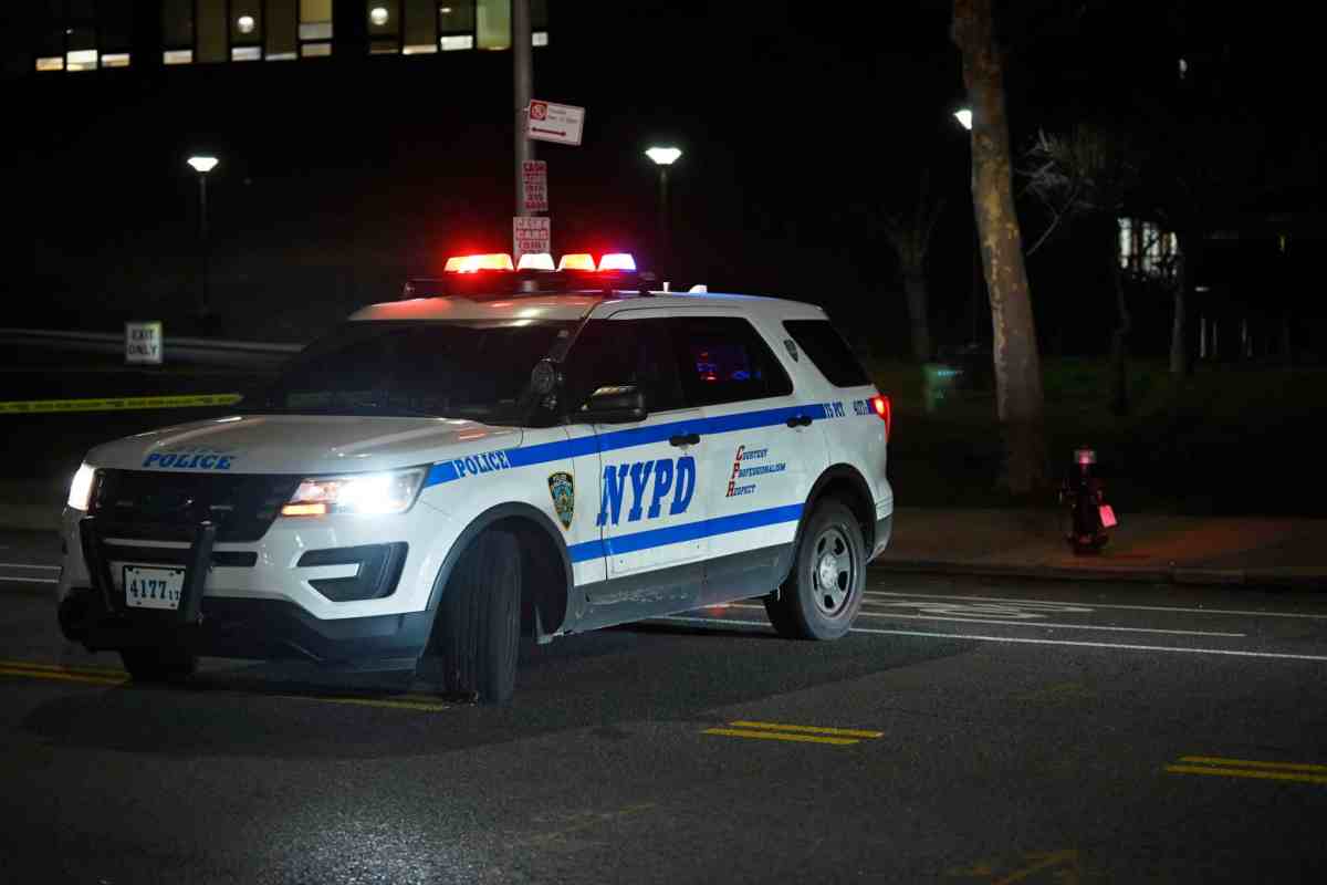 An NYPD vehicle at the scene of a crime.