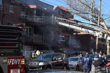 Firefighters rescued three civilians trapped in heavy clutter during a house fire at 654 East 79 St. in Brooklyn.