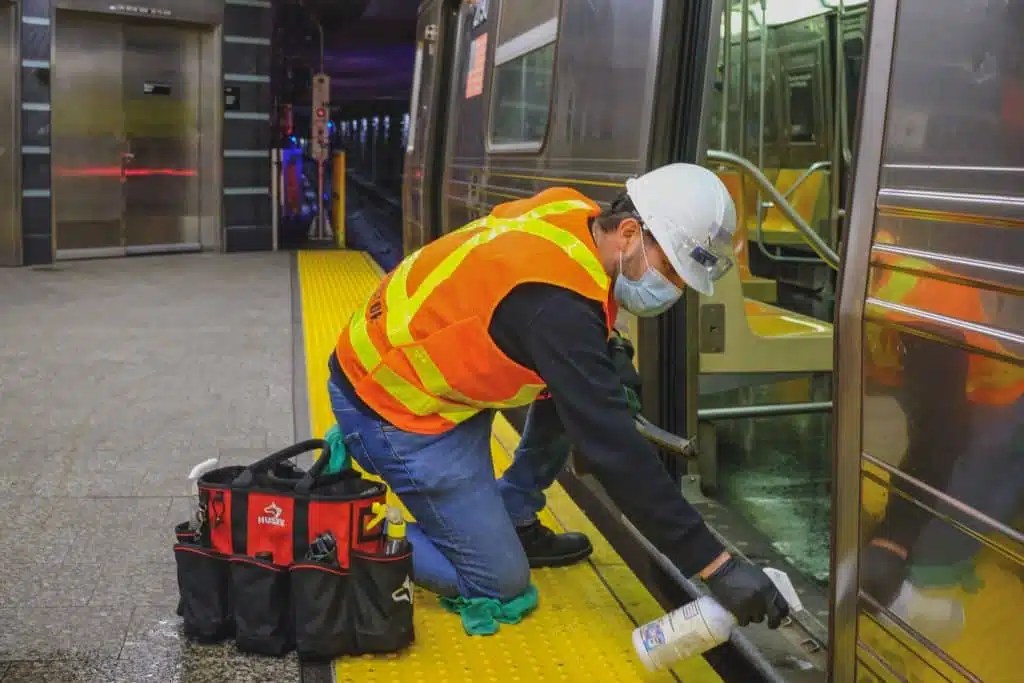 MTA cleaner disinfecting subway car during COVID-19 pandemic