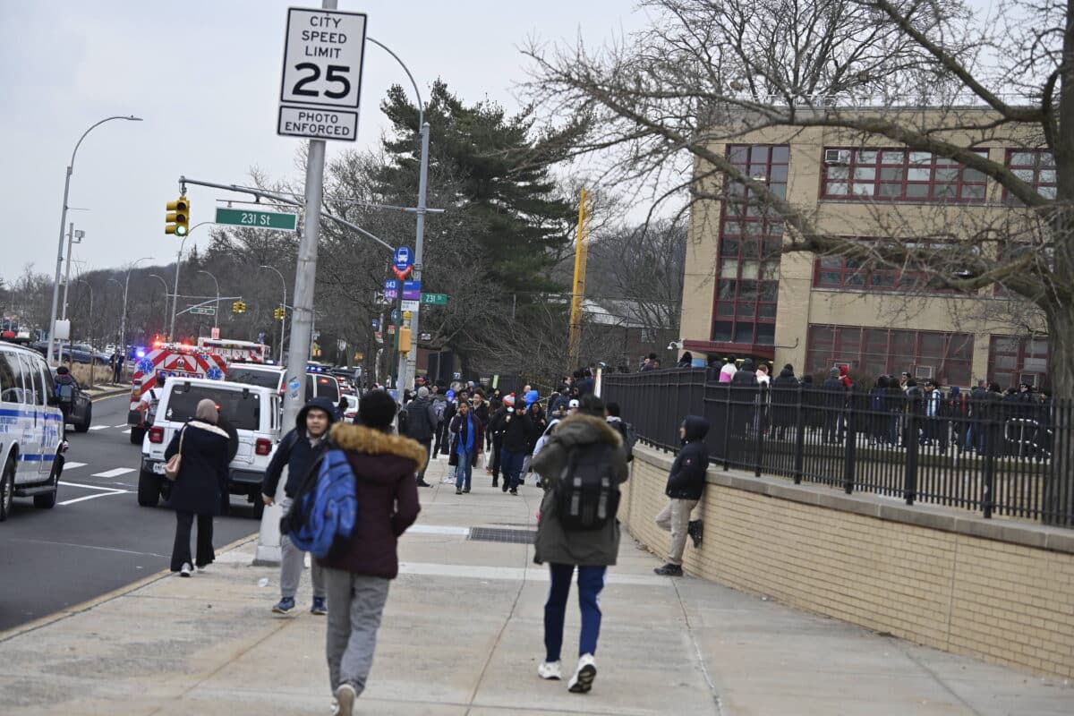 Police and Queens high school students after stabbing