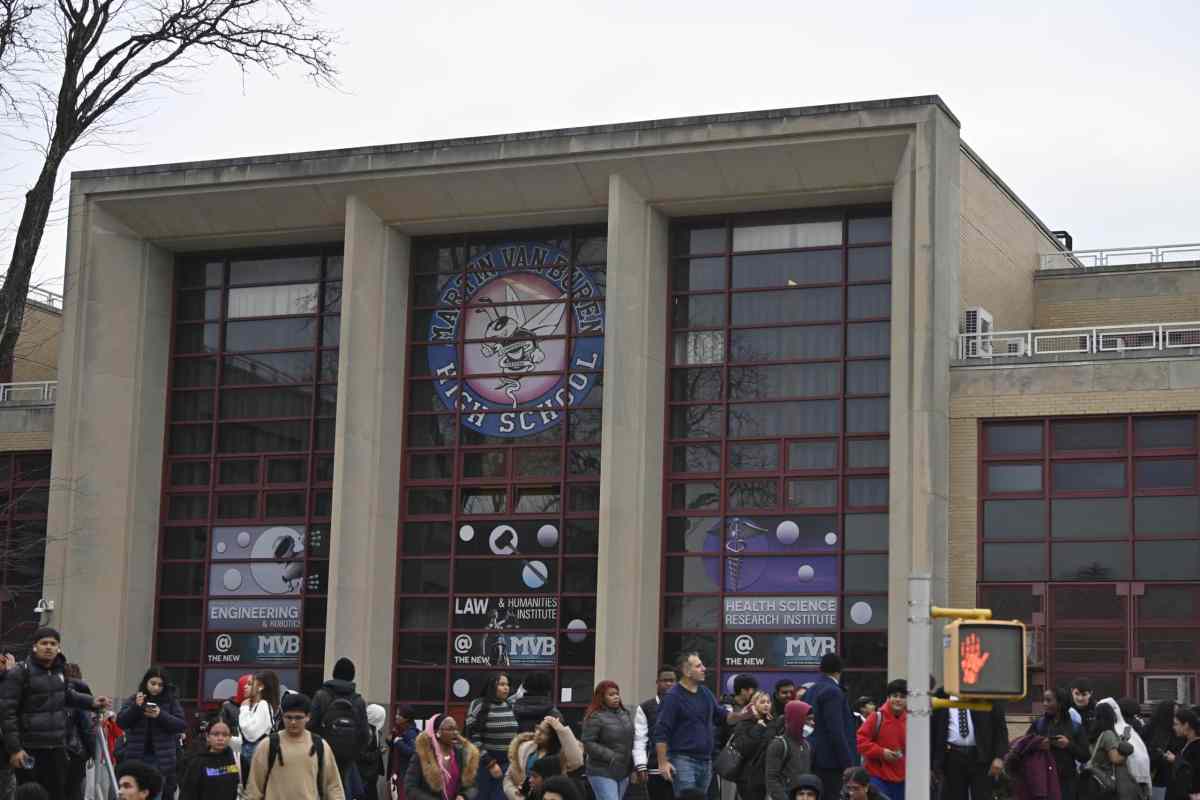 Police and Queens high school students after stabbing