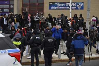 Police and Queens high school students after stabbing