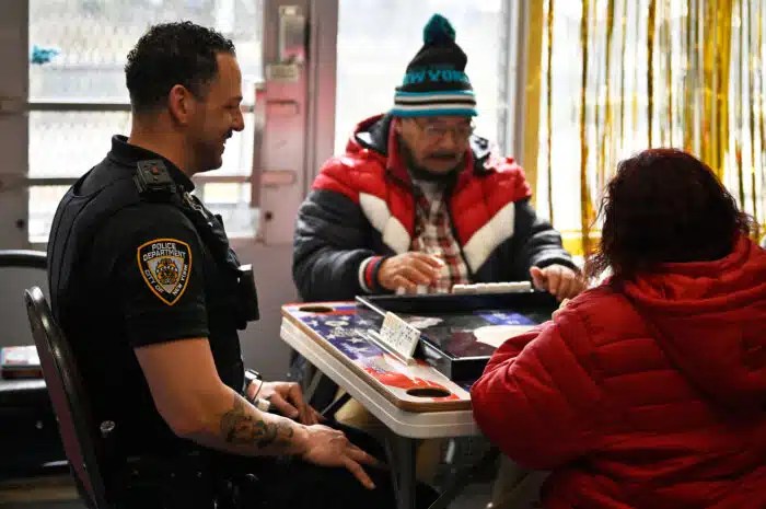Brooklyn police officer plays dominoes with seniors