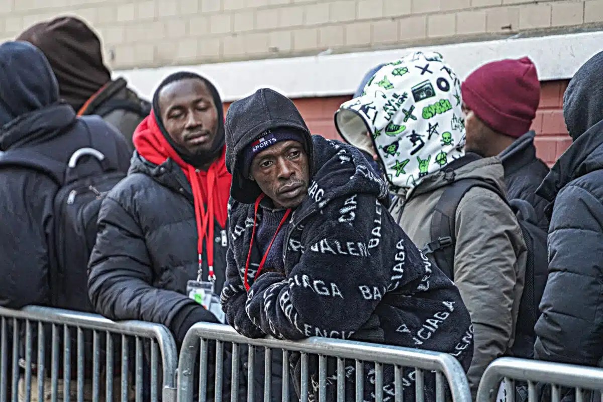 Migrants wait for services