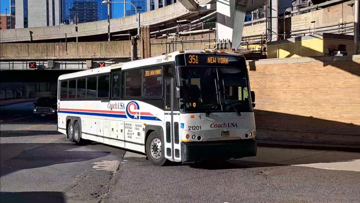 A commuter bus traveling in Manhattan before congestion pricing