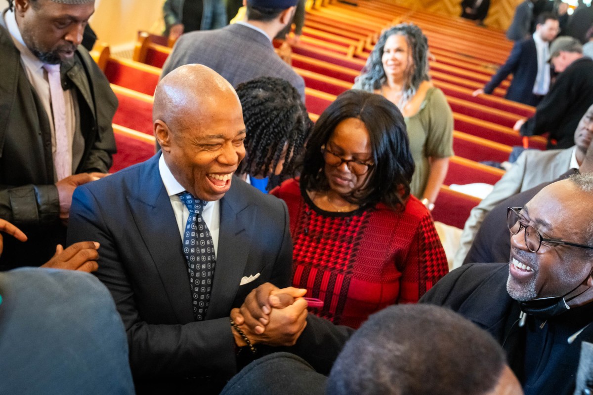 Mayor Adams shaking hands with constituents