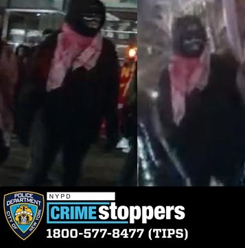 police photo of suspect wearing all black and a red and white scarf involved in an assault on a cop in lower Manhattan