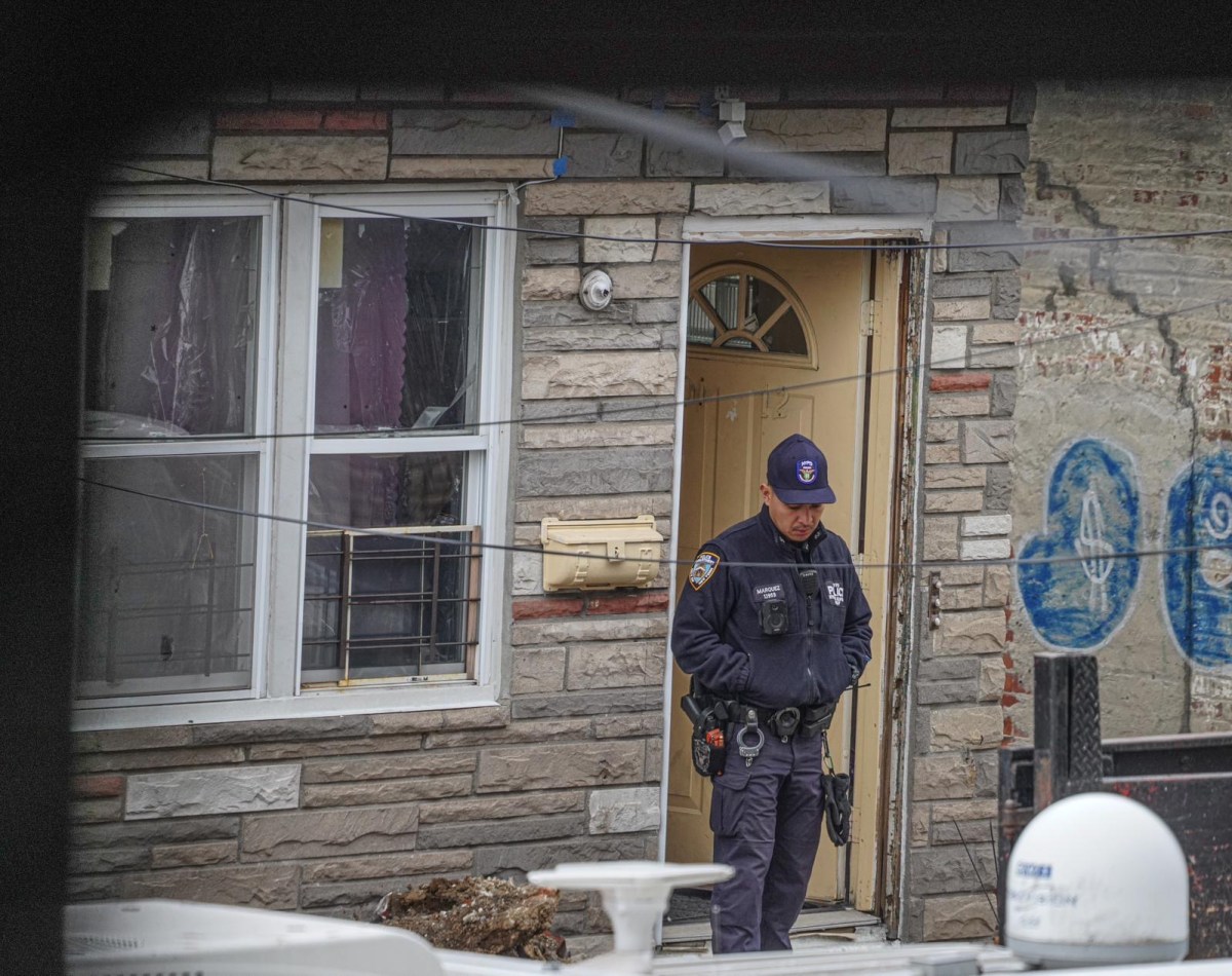 Police outside the home on 103rd Street off 101st Avenue in Ozone Park, Queens where officers shot an armed individual on March 27, 2024, police sources reported