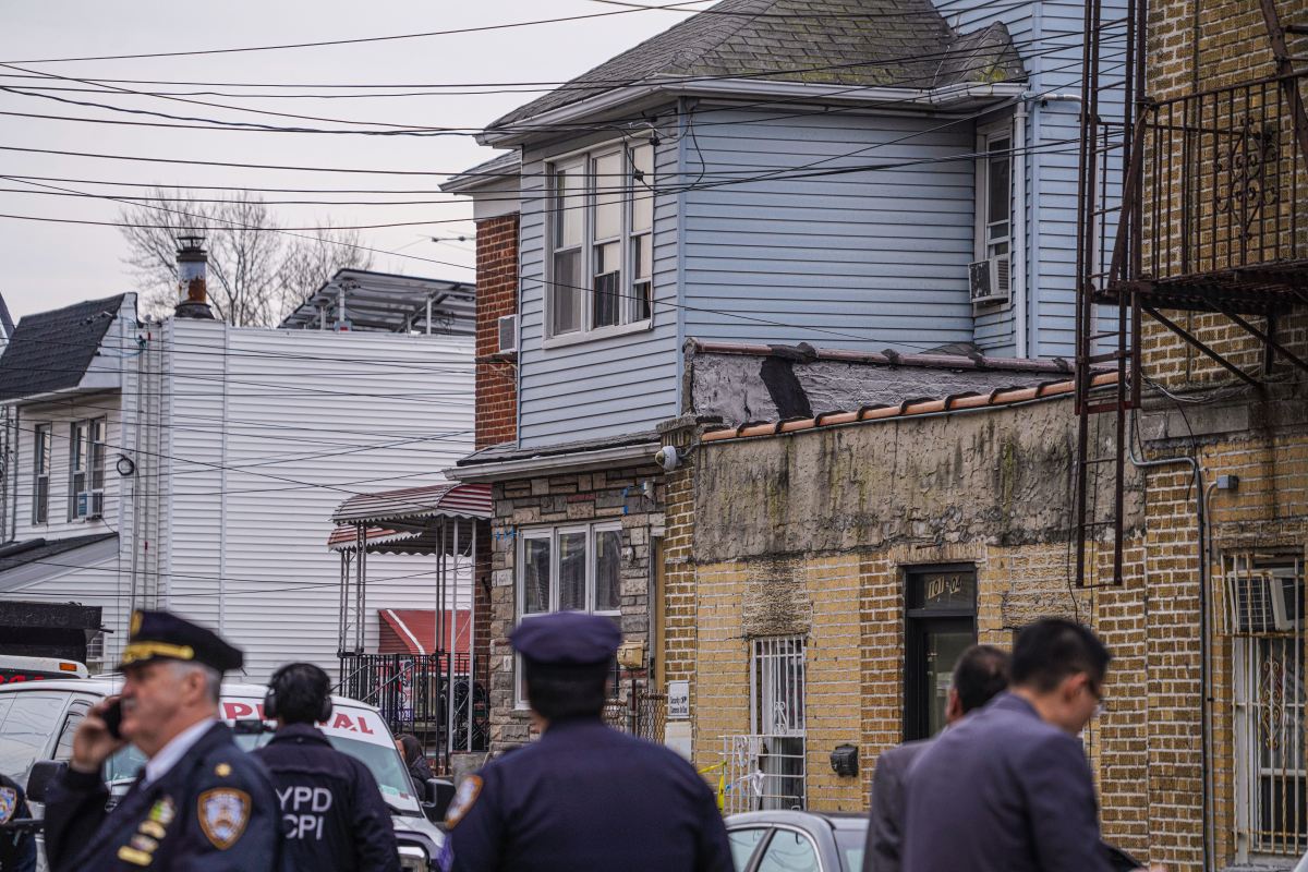 Police at the scene of the shooting in Queens