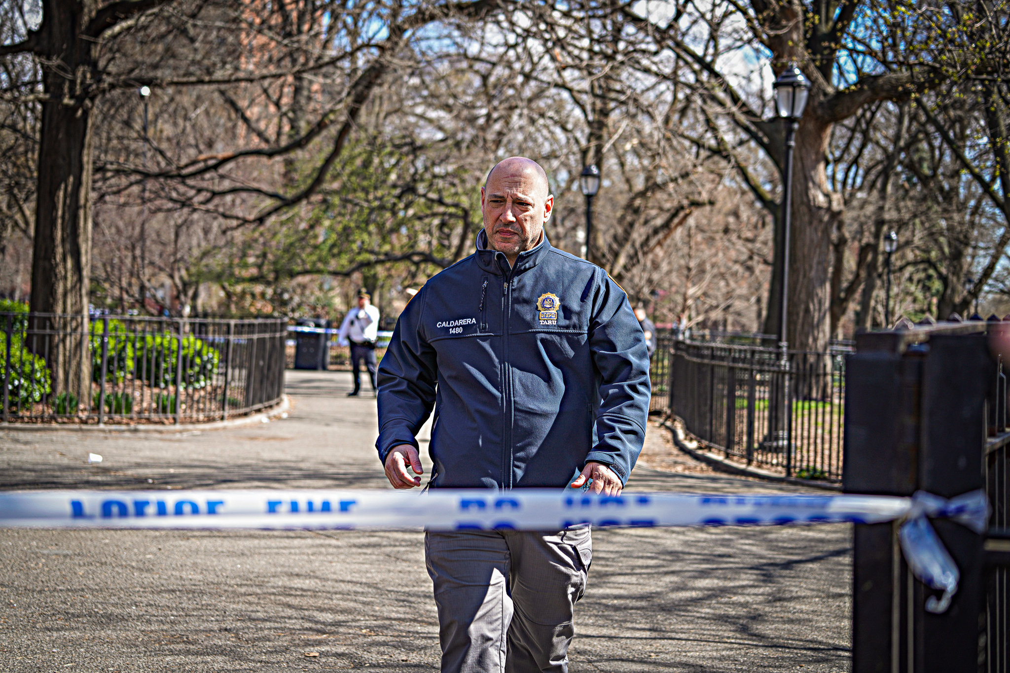 Two people enjoying the warm weather in Tompkins Square Park on Saturday were shot after being caught in the crossfire when bullets rang out, police and eyewitnesses said.