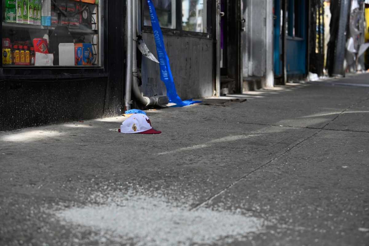 hat lays on the sidewalk