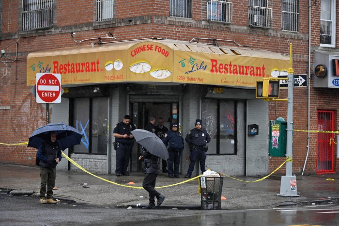 People walk past scene of deadly Brooklyn shooting