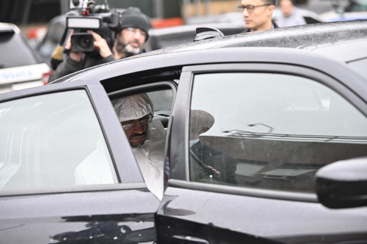 man sitting in car