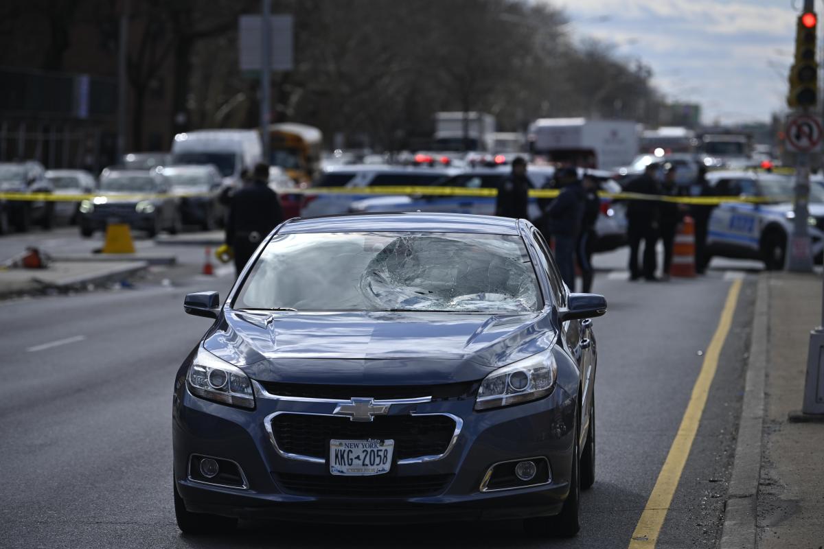 Police and car at scene of deadly Brooklyn collision involving pedestrian