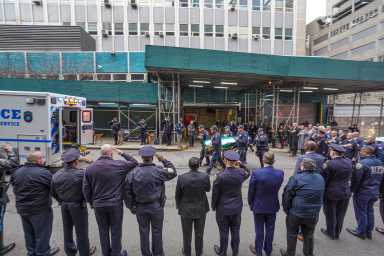NYPD officers salute body of Officer Jonathan Diller