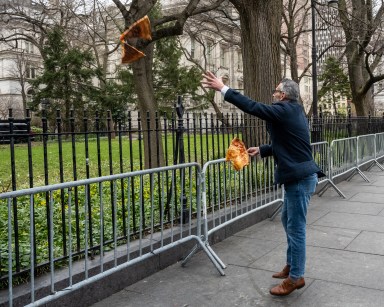 Staten Island man throws pizza slice over City Hall gate