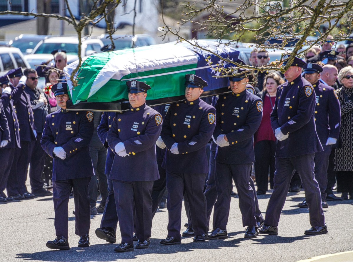 NYPD officers carry the flag draped casket of slain Police Officer Jonathan Diller