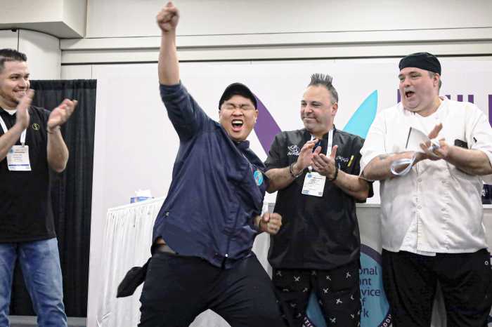 Queens restaurant owner celebrates winning food competition