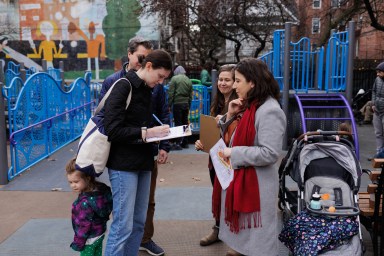 Parent signs petition in Brooklyn against child care cuts
