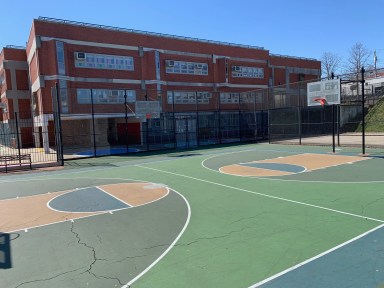 school playground in daytime. Transgender athletes could be banned from girls' sports due to a resolution from local school board