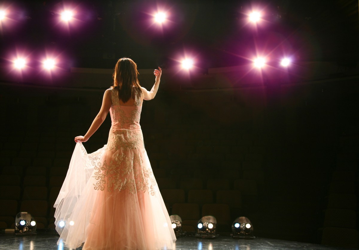 Woman performing arts on stage