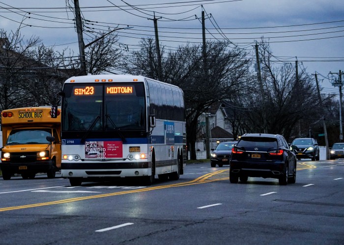An express bus operating on a rainy street on Staten Island