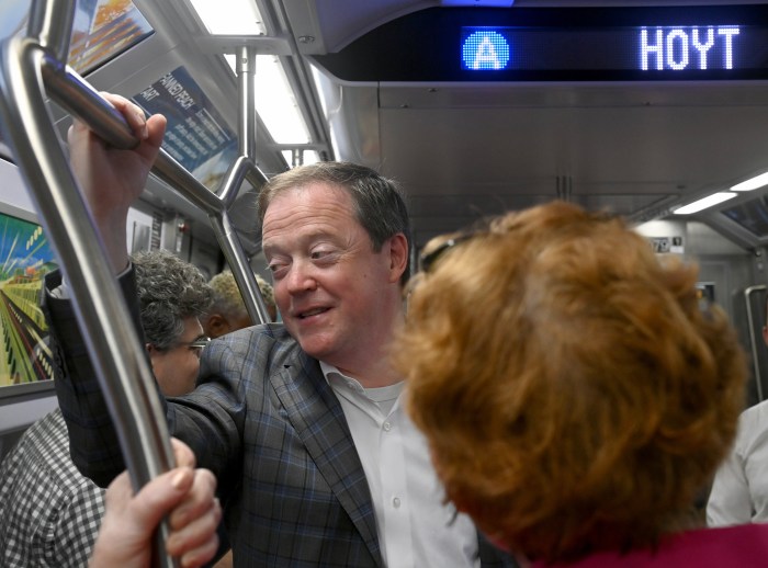 MTA New York City Transit President Richard Davey talking with subway commuters
