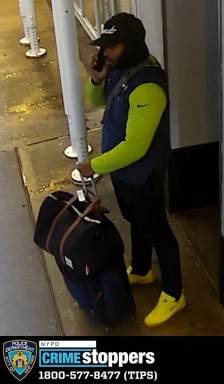suspect wearing black and yellow holding a bag, wanted for attempted robbery Midtown Manhattan