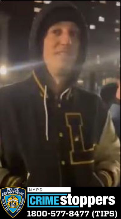 man wearing jacket with the letter "L" wanted for hate crime in Manhattan