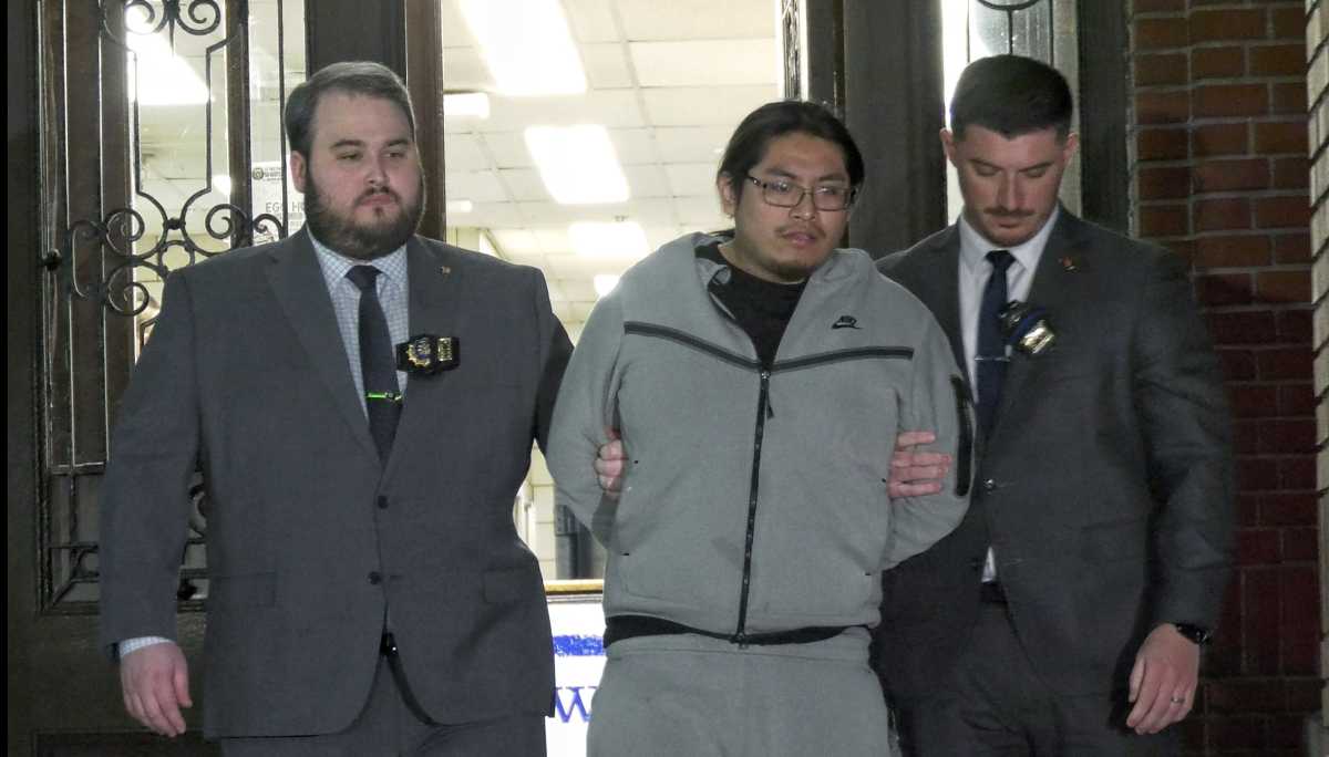 Bronx shooting suspect escorted by detectives