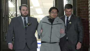 Bronx shooting suspect escorted by detectives