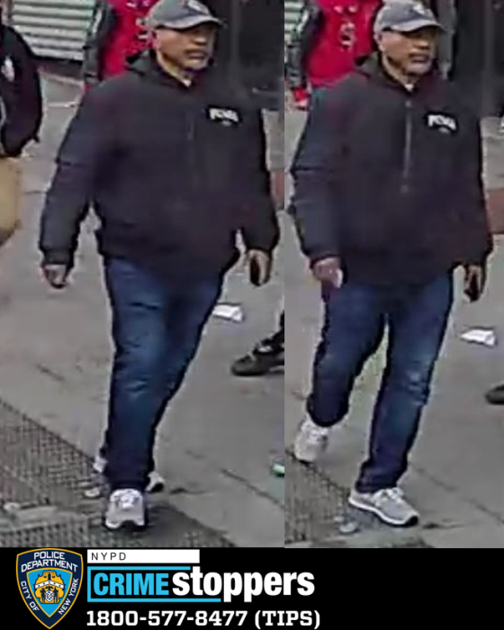 photo of a suspect wearing black jacket and walking; wanted for stabbing a man in the East Village