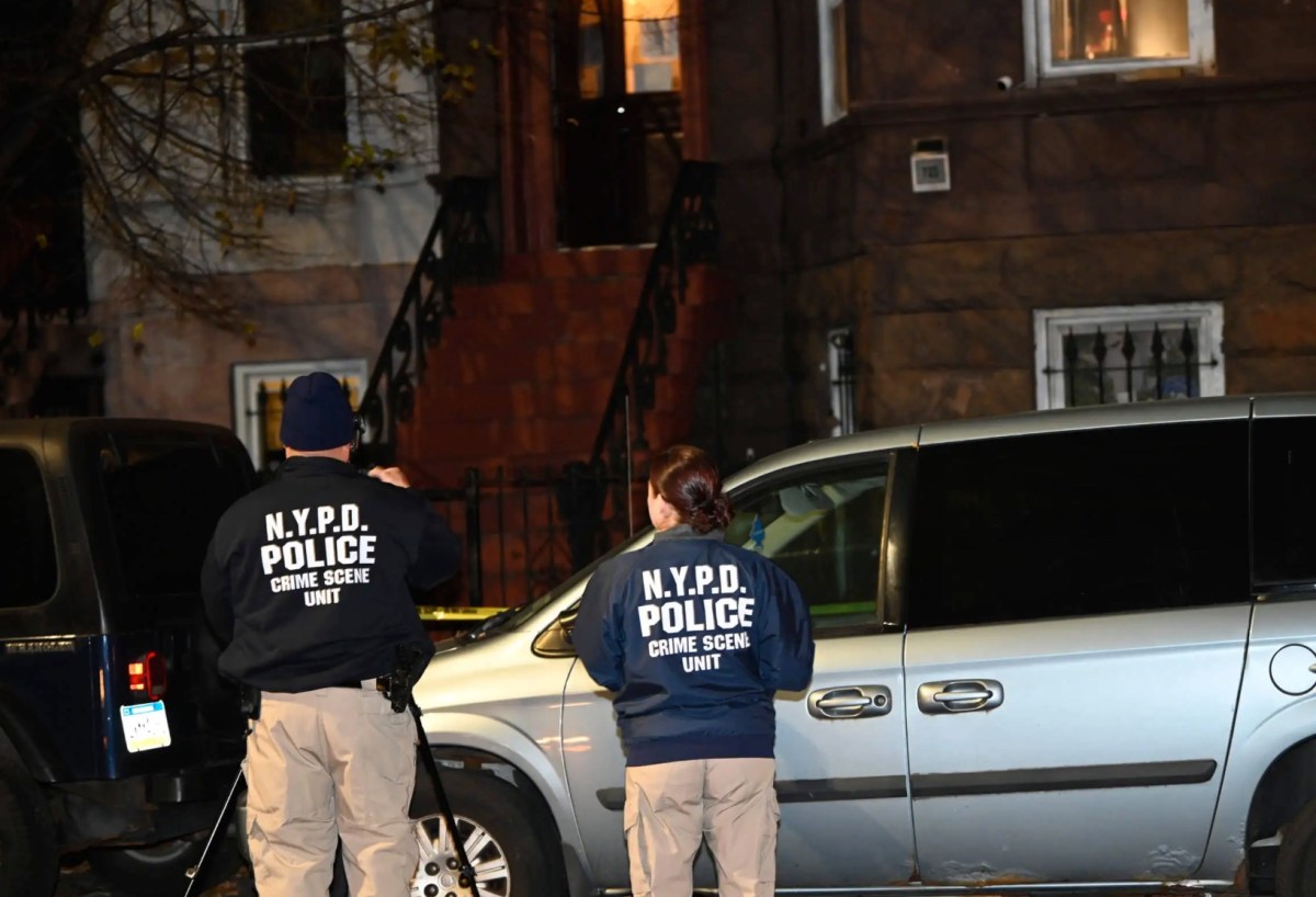 NYPD crime scene unit members at Brooklyn shooting scene