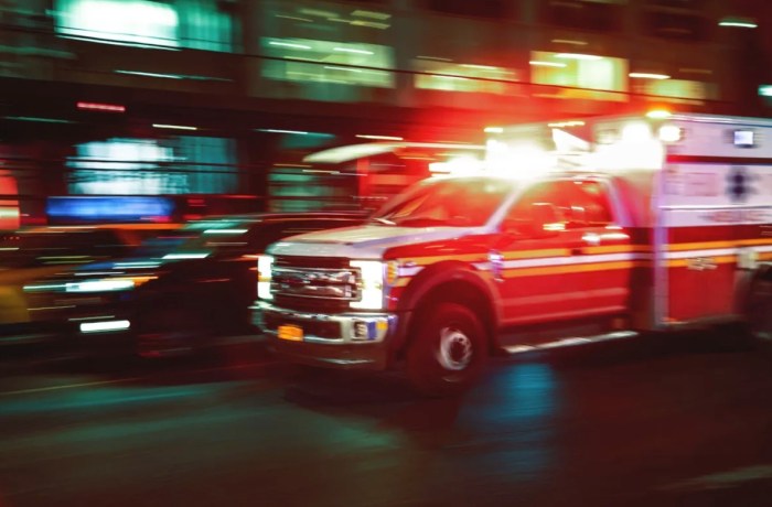 EMS ambulance responds in the Bronx with lights flashing