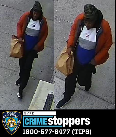 Bronx hate crime suspect holding paper bag